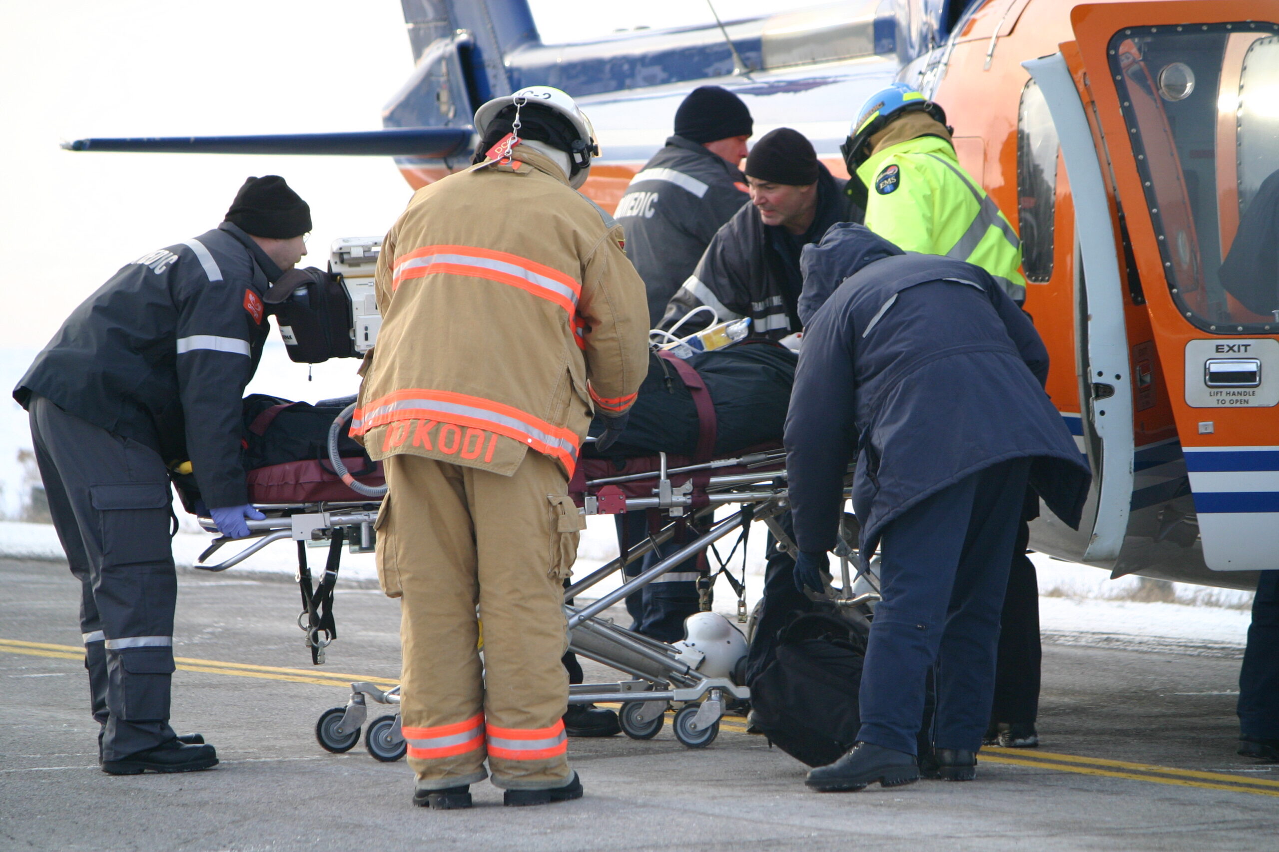 A patient being loaded into an air ambulance.