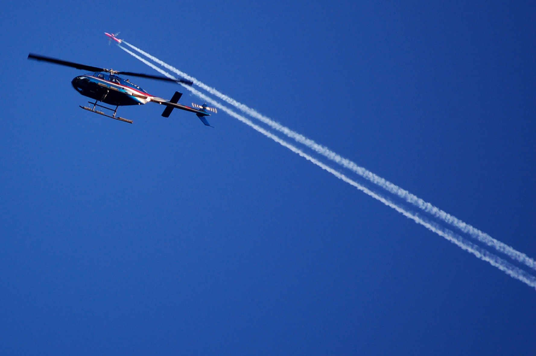 Aircraft contrails crossing the sky.