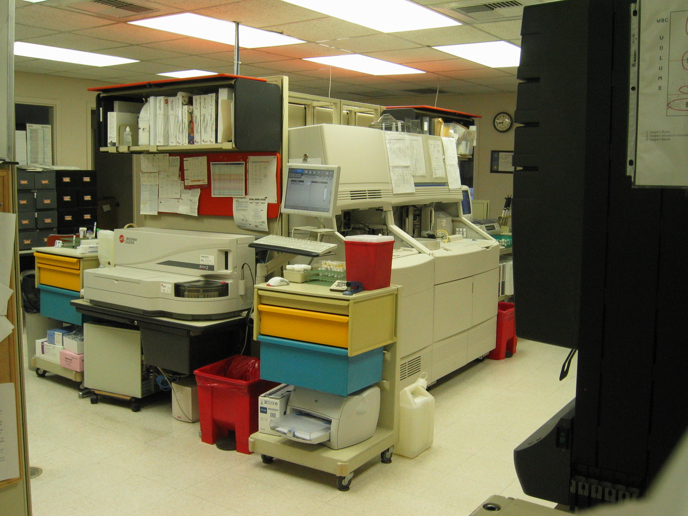 Chemistry analysers in a hospital laboratory.