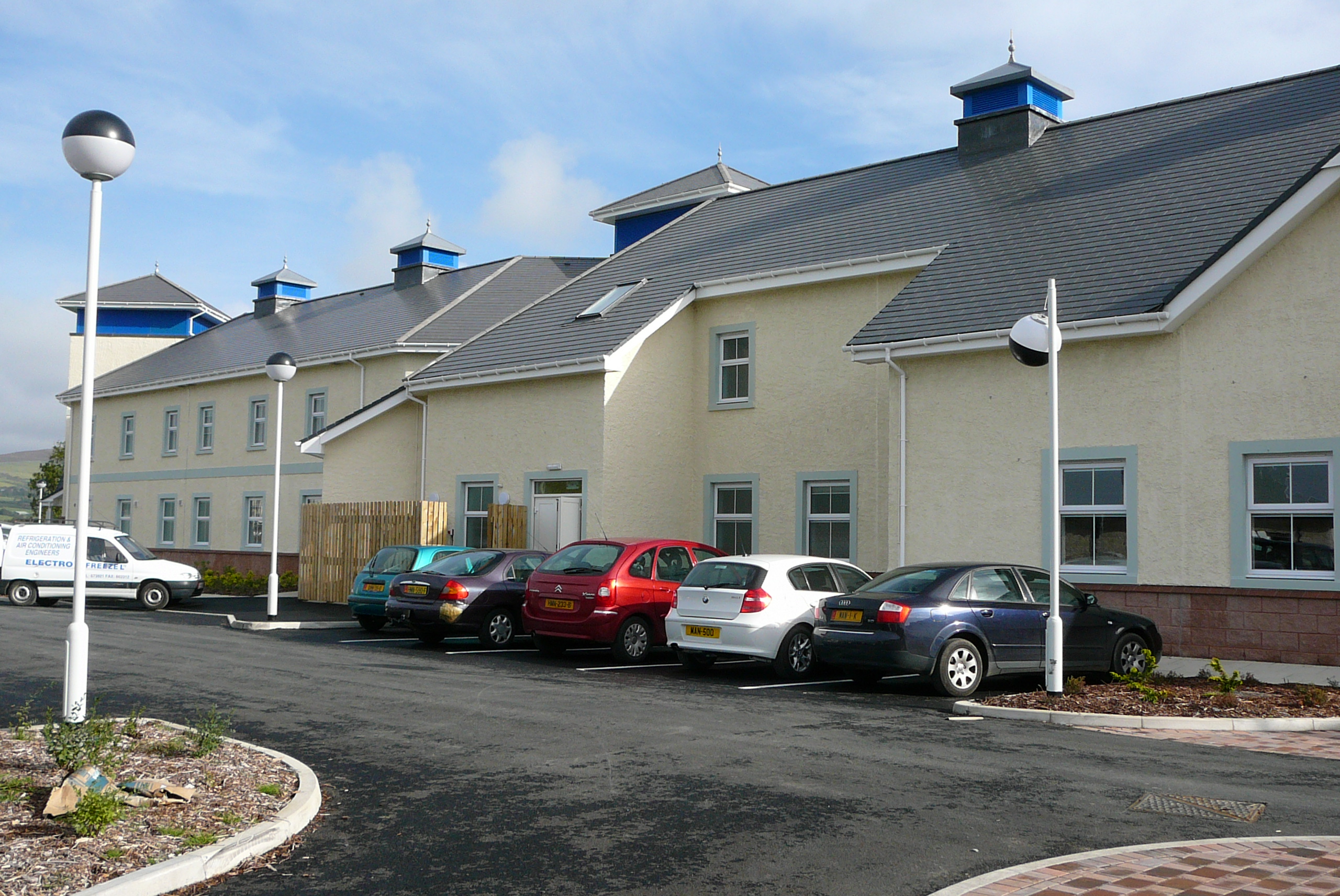 The exterior of a modern hospice building.