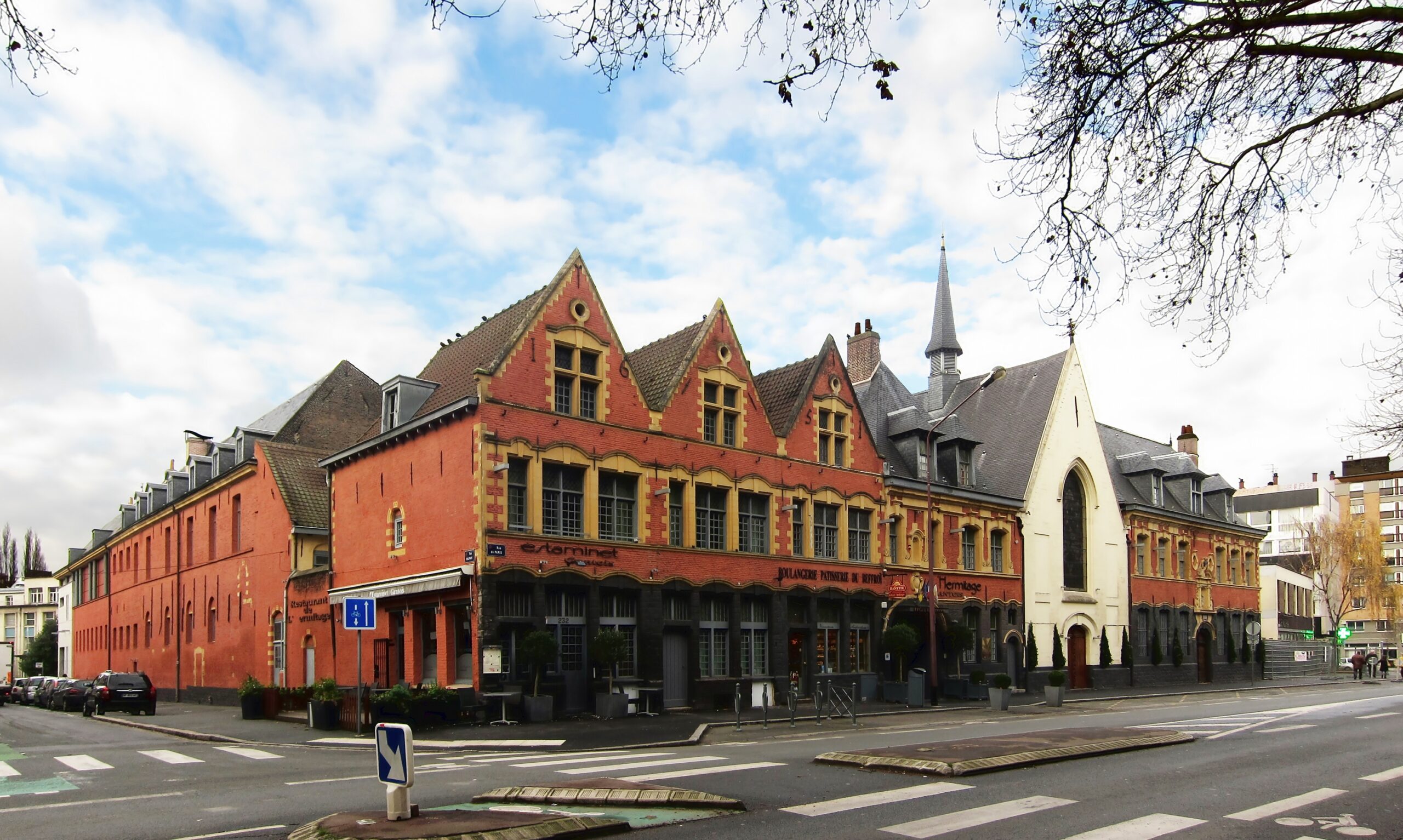 The facade of a historic hospice building.