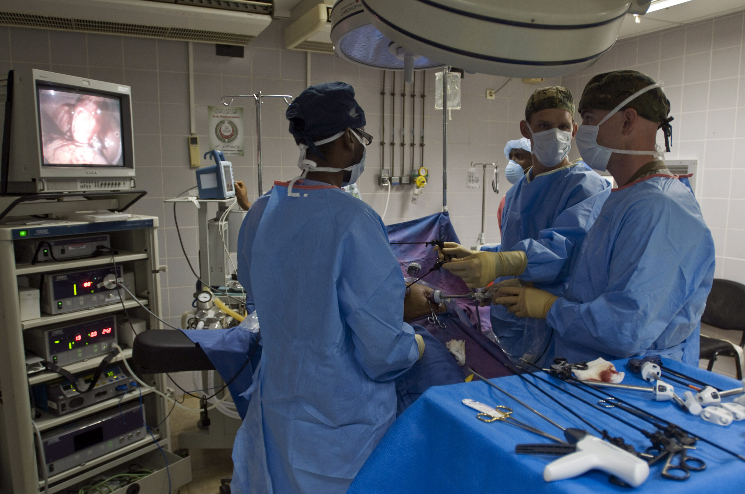 Surgeons performing a laparoscopic procedure.