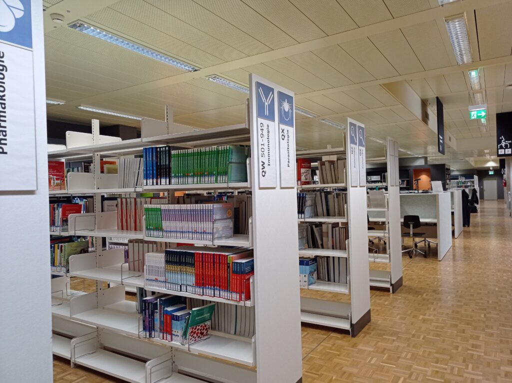 Shelves of bound medical journals in a university library