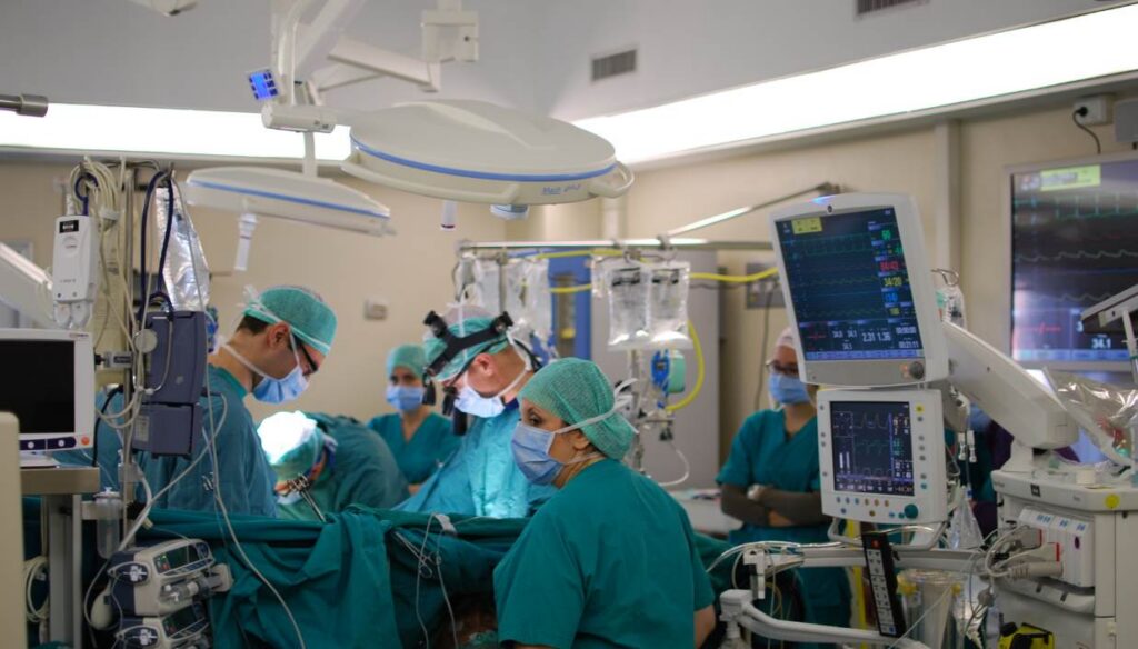 A cardiac surgical procedure under way in a hospital operating room
