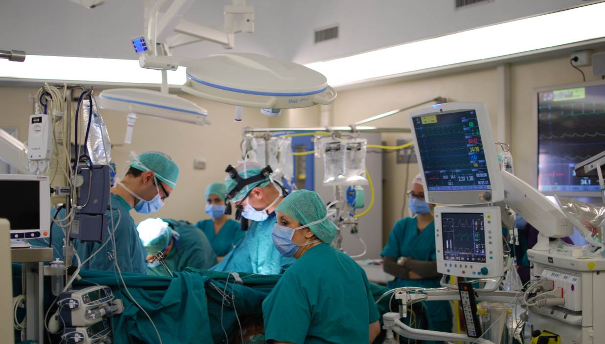 A cardiac surgical procedure under way in a hospital operating room