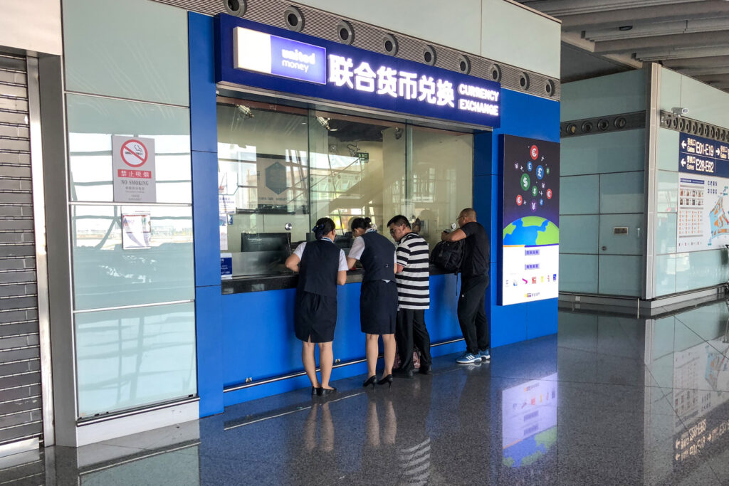 A currency exchange counter in the international departures concourse at Beijing Capital International Airport