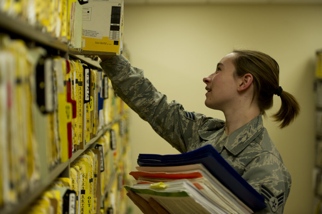 Paper medical records being filed in a records office