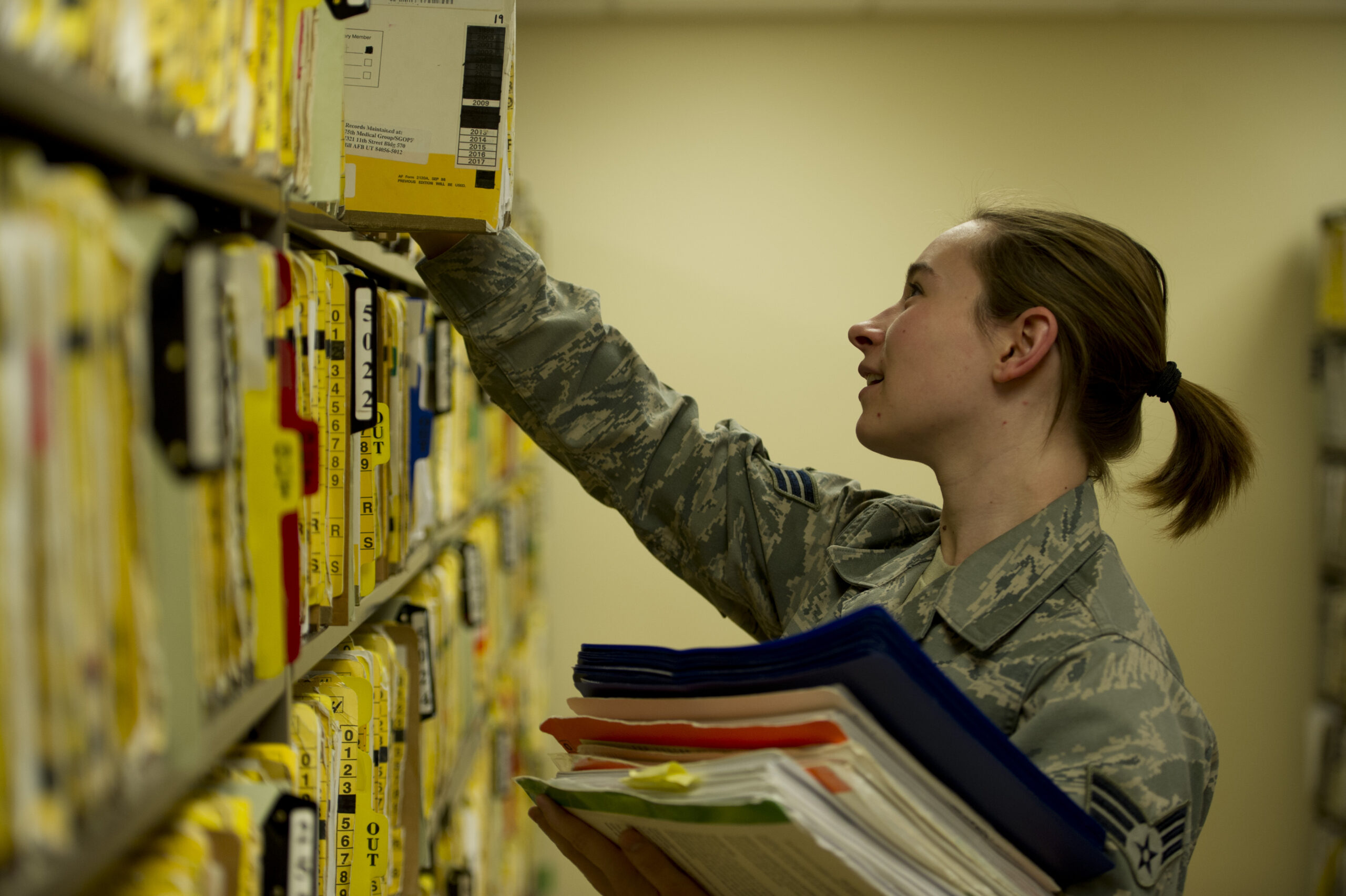 Paper medical records being filed in a records office