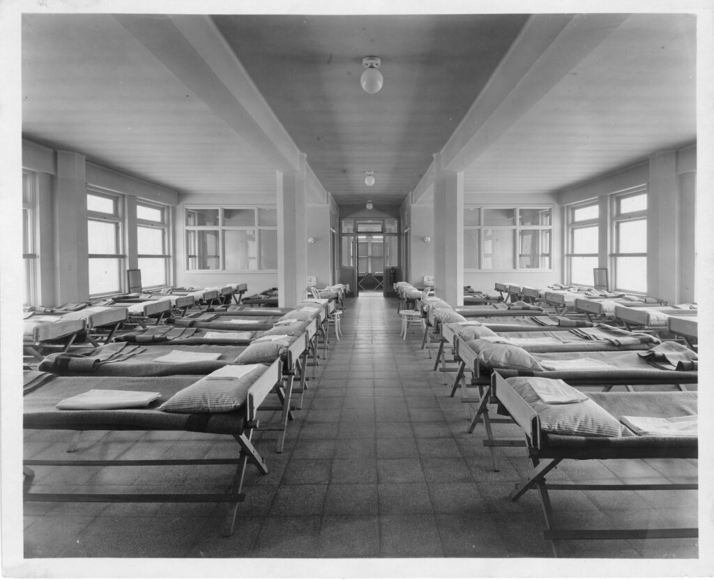 Rows of empty beds in a hospital ward