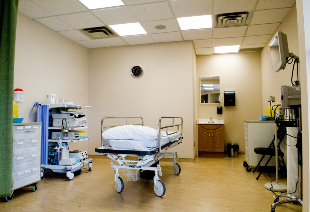 A stack of endoscopy equipment on a mobile trolley in a procedure unit
