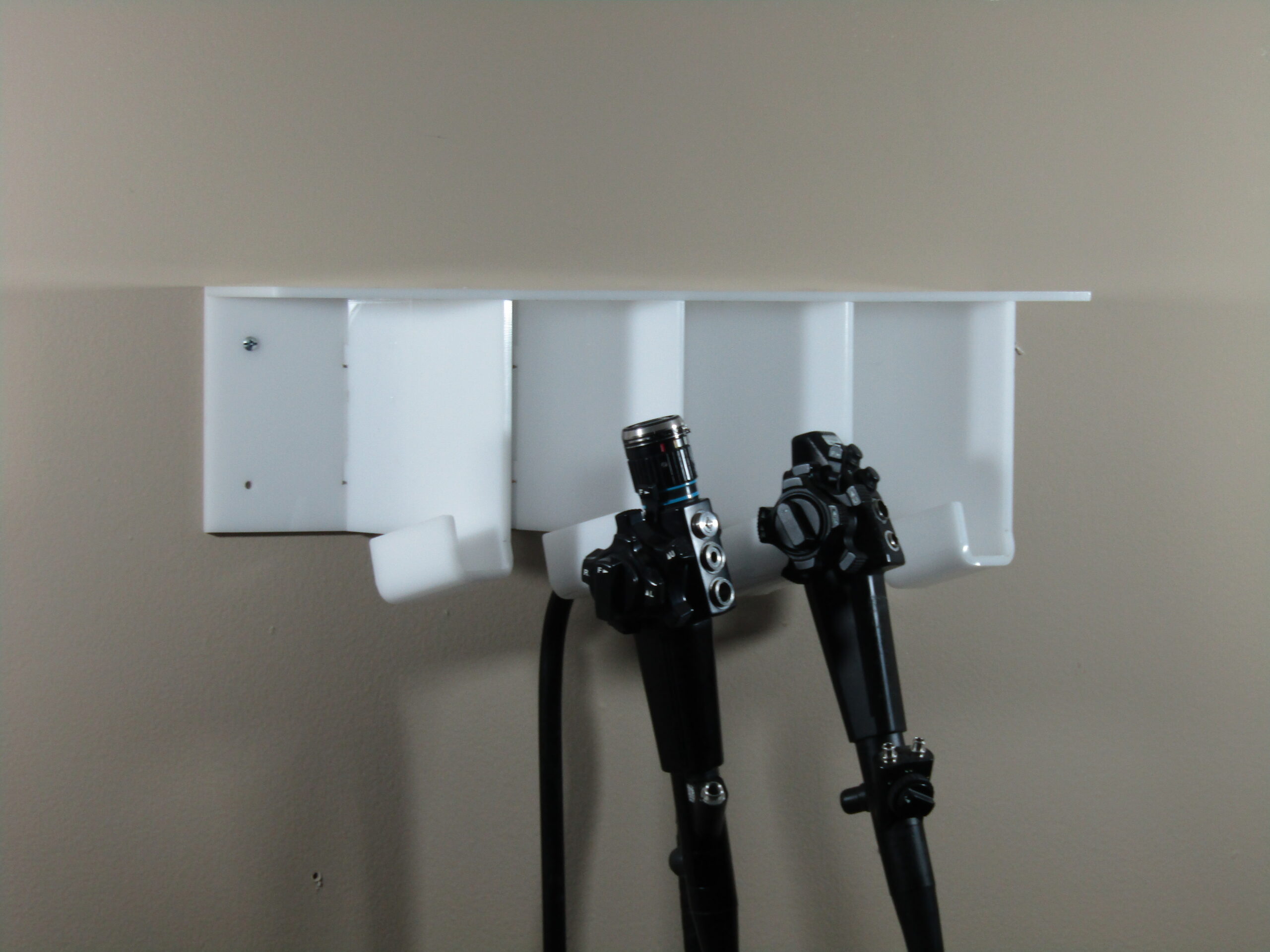 Flexible endoscopes on a wall-mounted storage rack