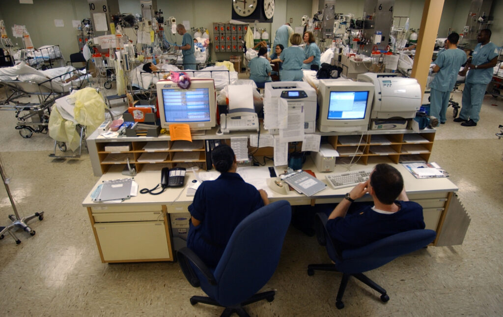 A central monitoring station displaying vital signs for patients in an intensive care unit